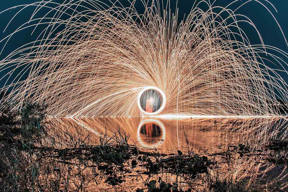 A circular shower of sparks from the team fireworks at the team-building event at TRIFORÊT alpin.resort in Hinterstoder.